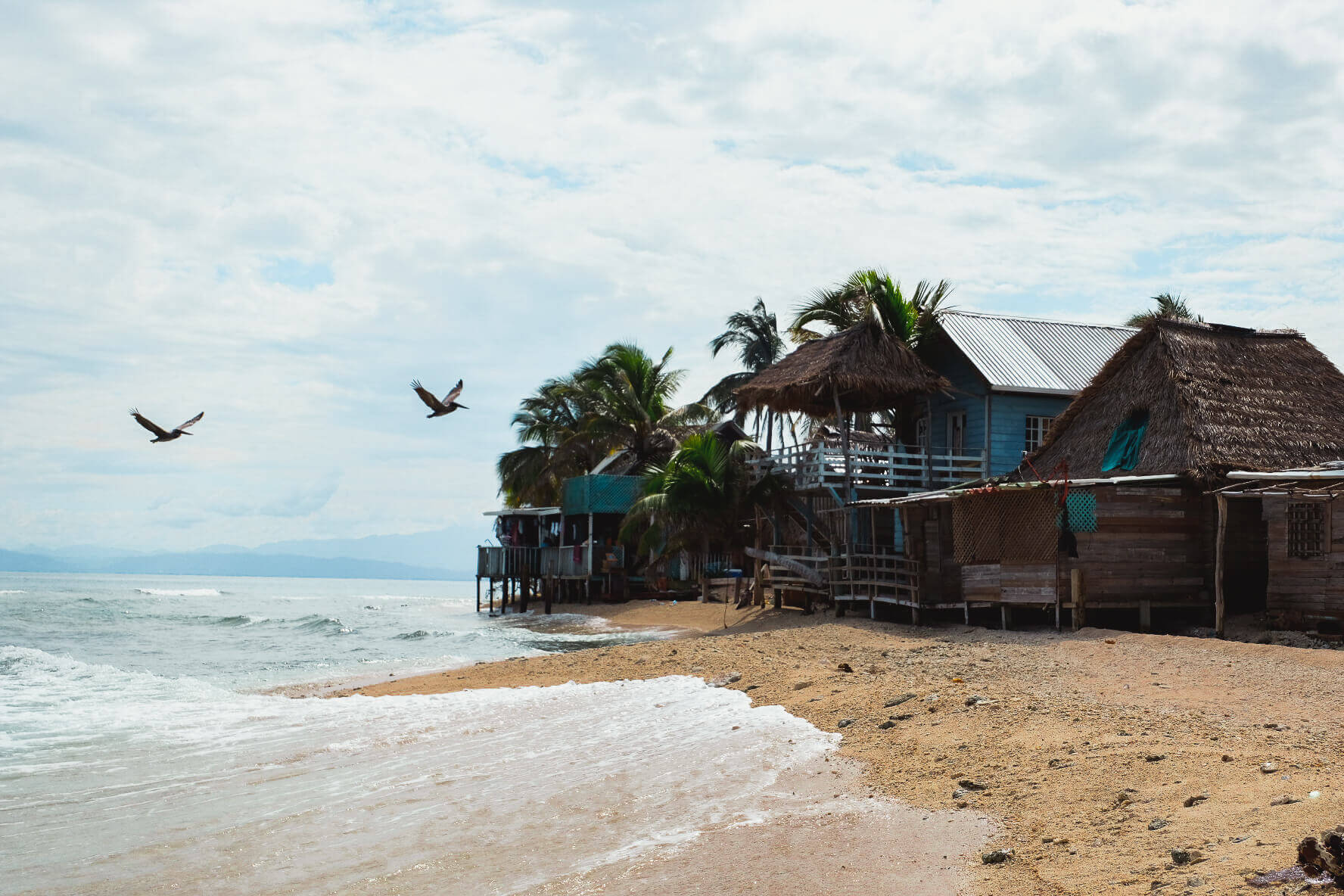 Backpackers and adventure travelers stay overnight in Garifuna village on Chachahuate Cay