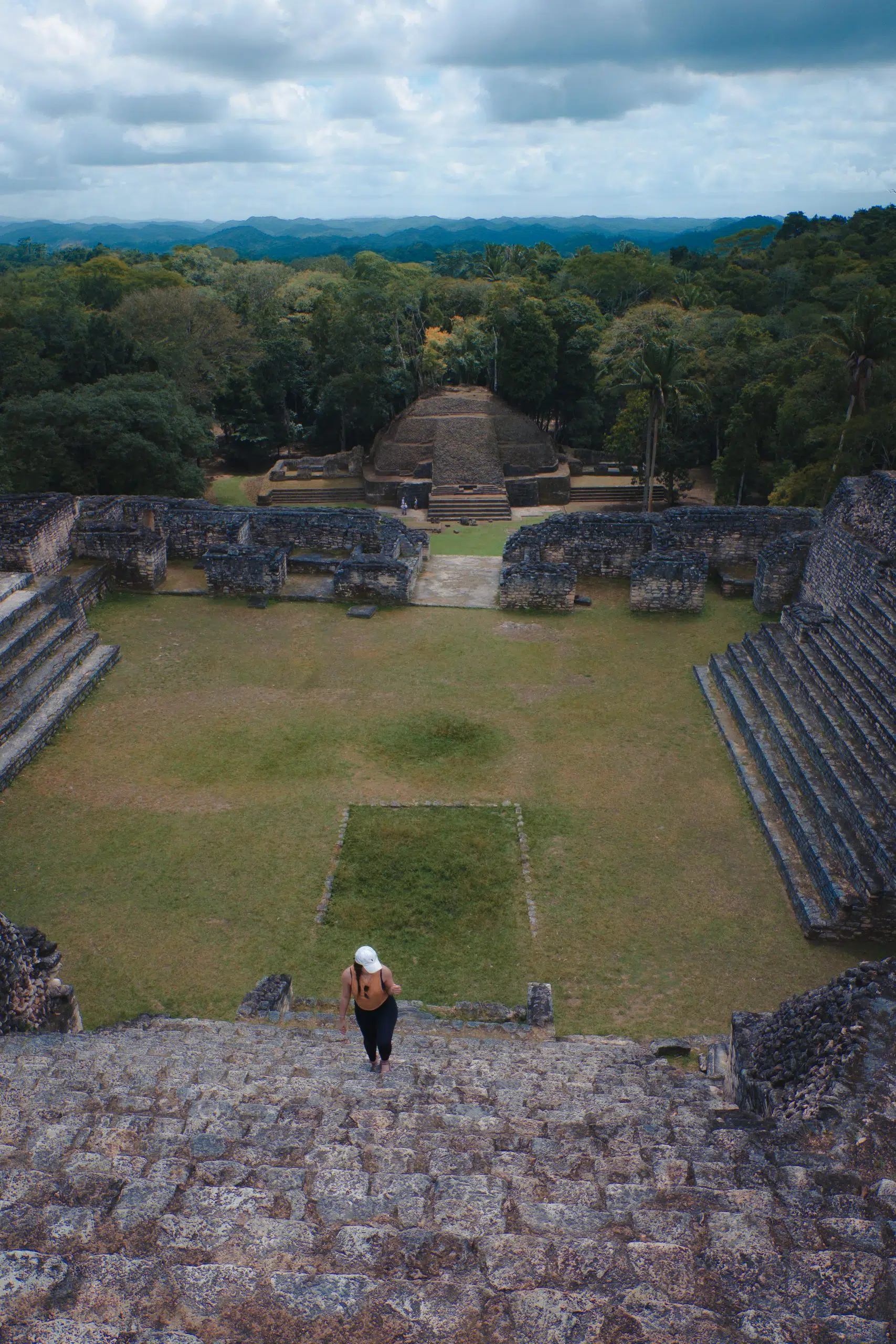 Climbing the stairs of the Mayan ruins at Caracol