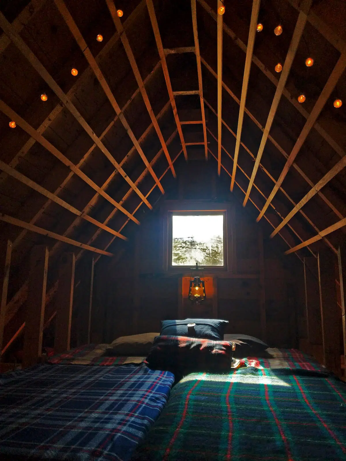 Loft bed in tiny cabin