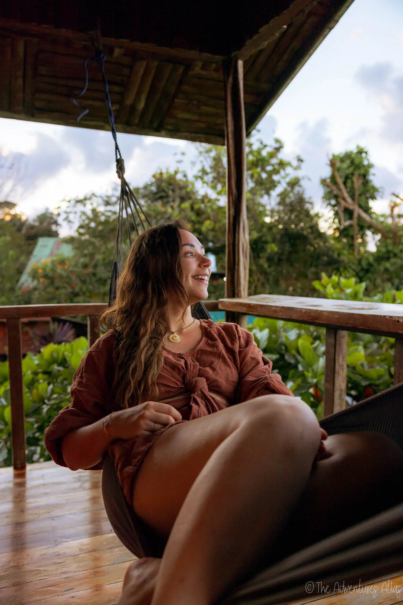 Girl in a hammock on the balcony of Las Cotingas Lodge in Drake Bay