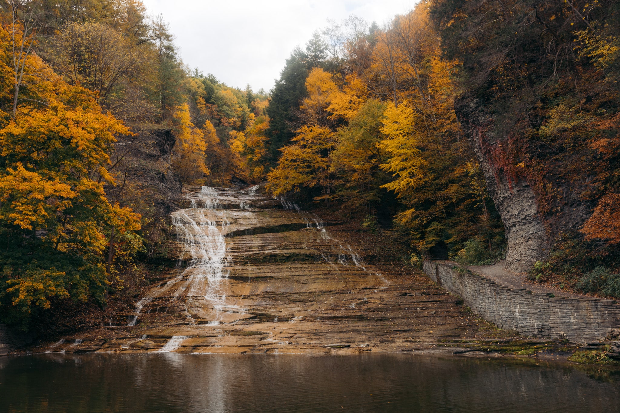 Buttermilk Falls waterfall with fall foliage in Ithaca NY