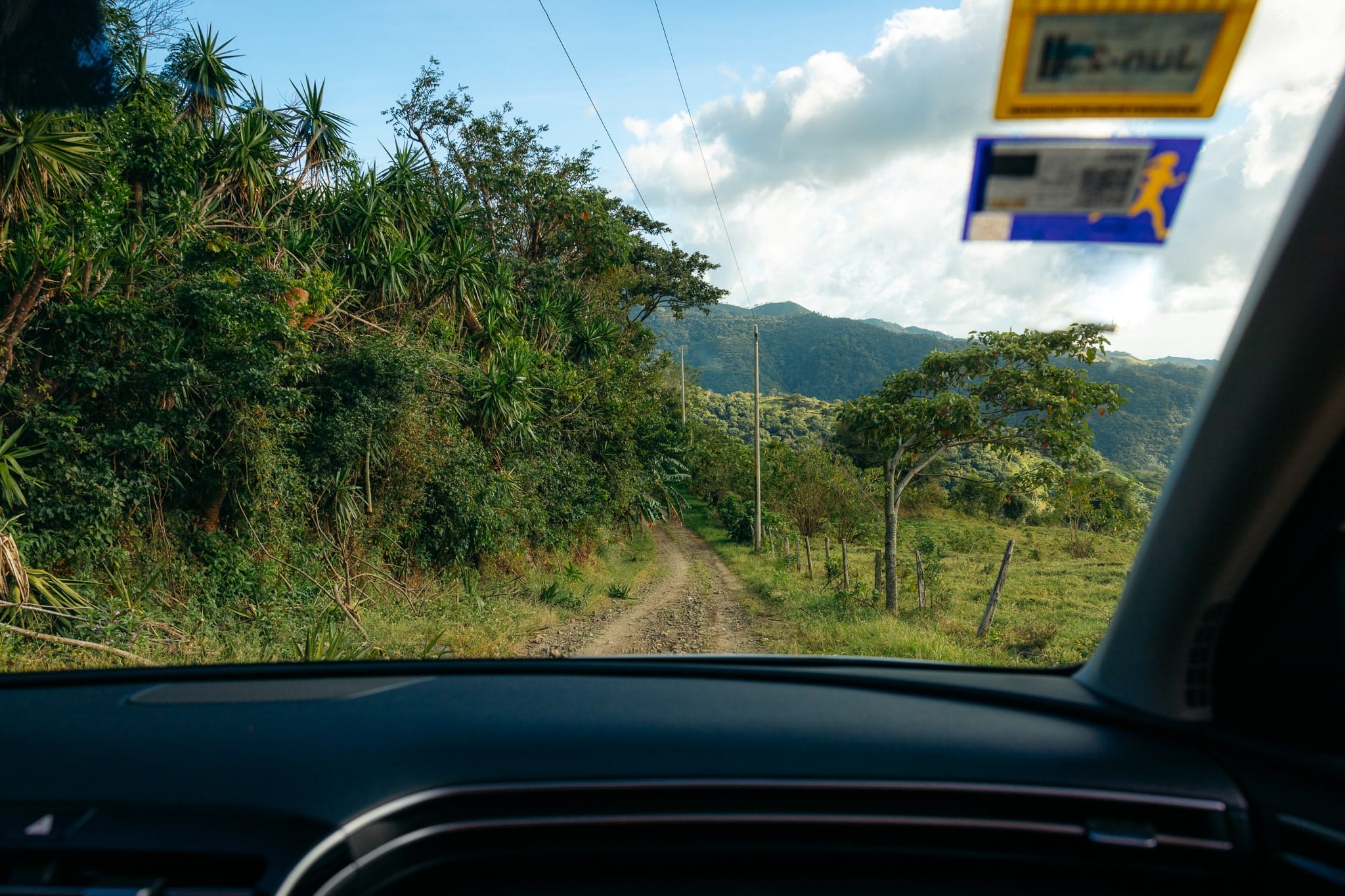 Looking out the windshield while driving on the back roads in Monteverde, Costa Rica