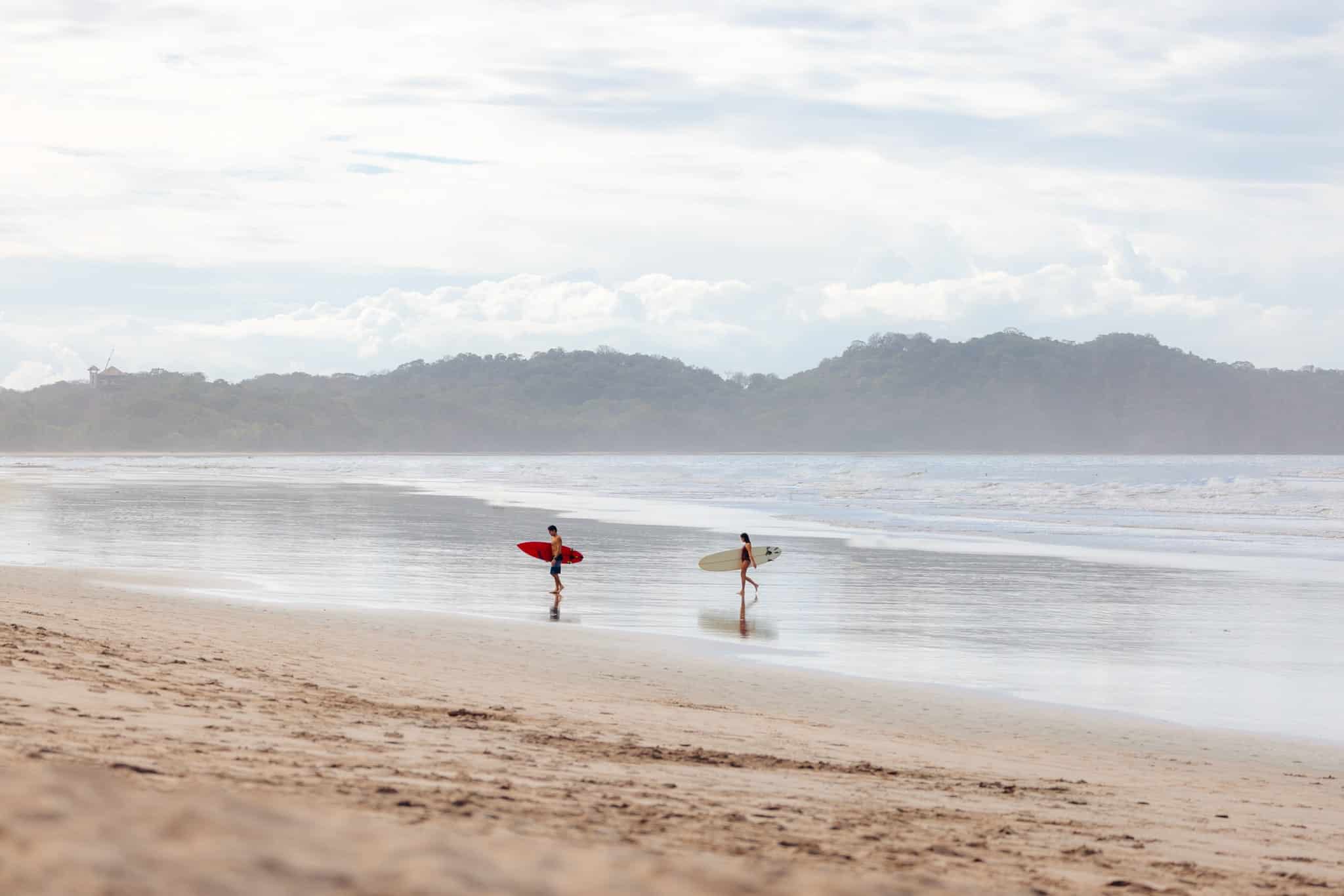 Surfers on the beach in Costa Rica