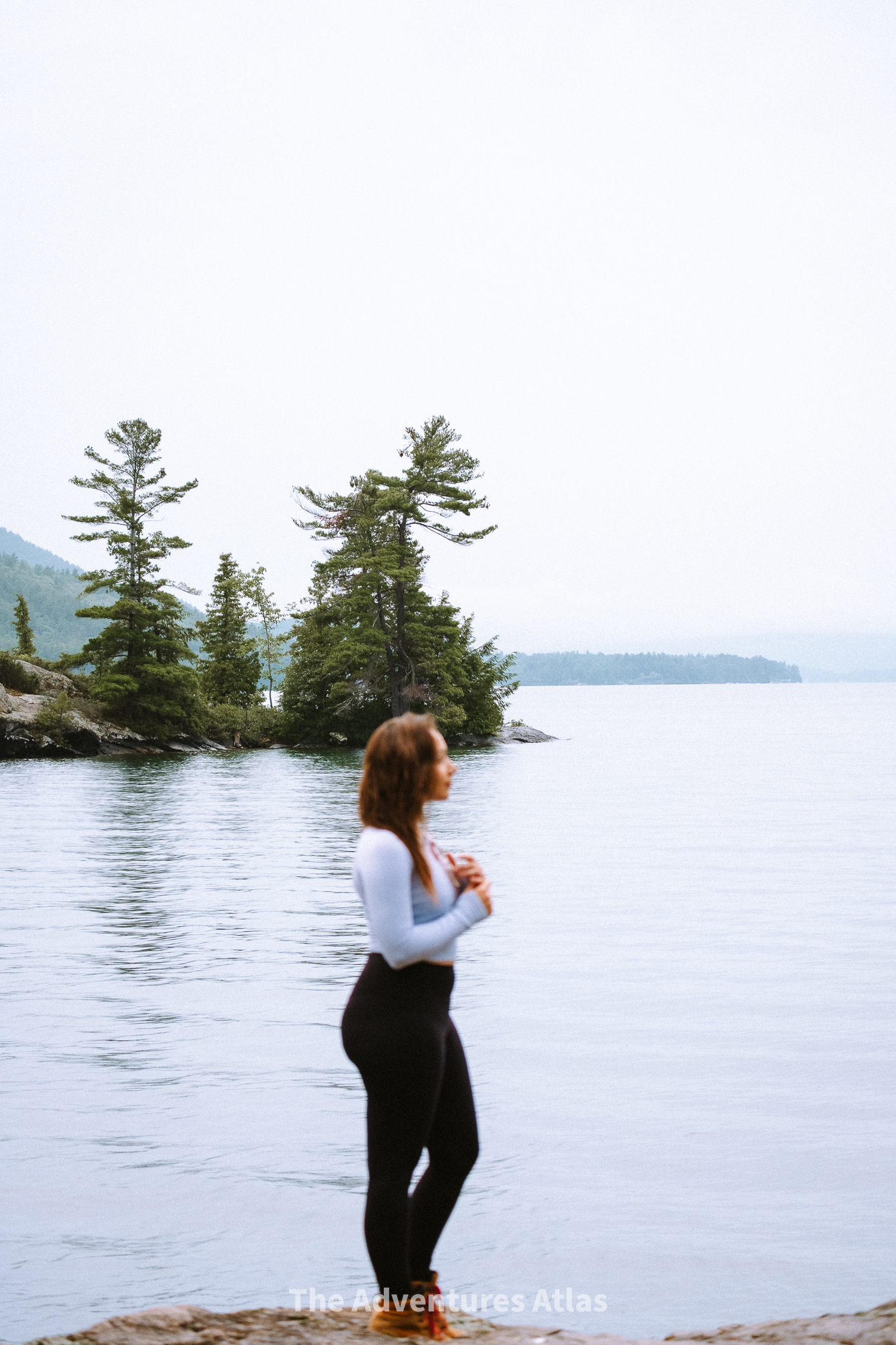 Girl standing on the shore of Lake George