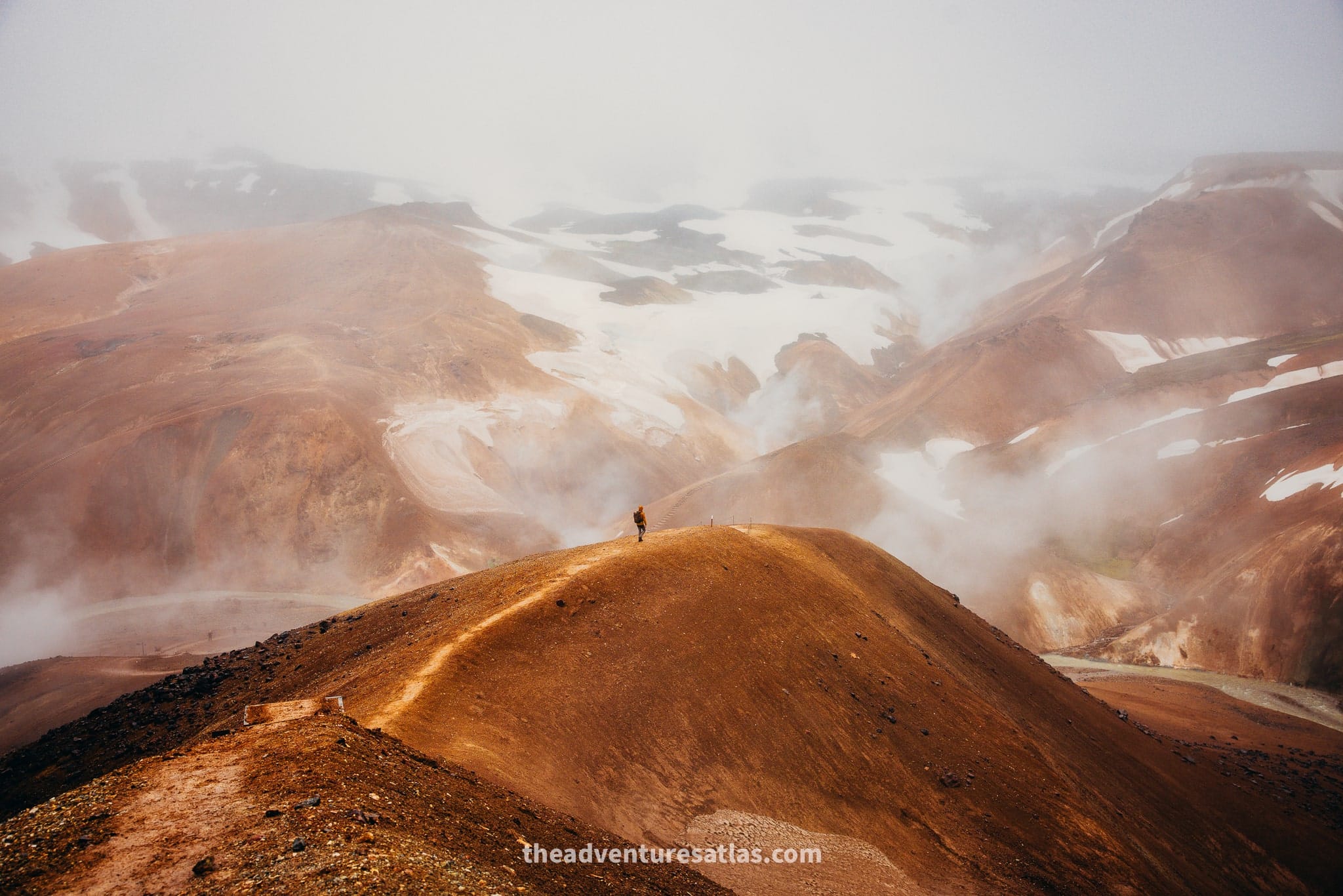 Hiker in the highlands dressed in hiking gear for summer in Iceland