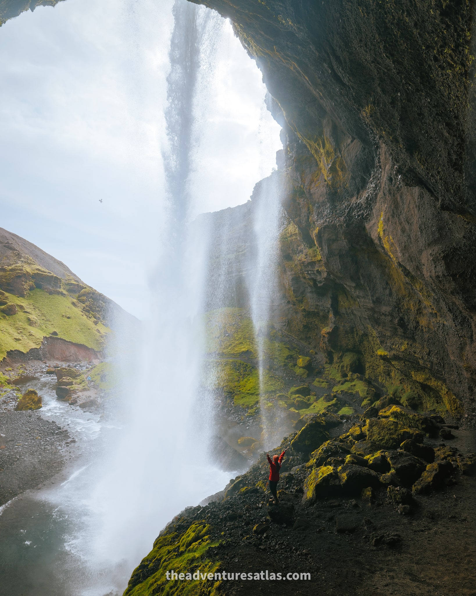 Hiker at Kvernufoss on the south coast of Iceland 