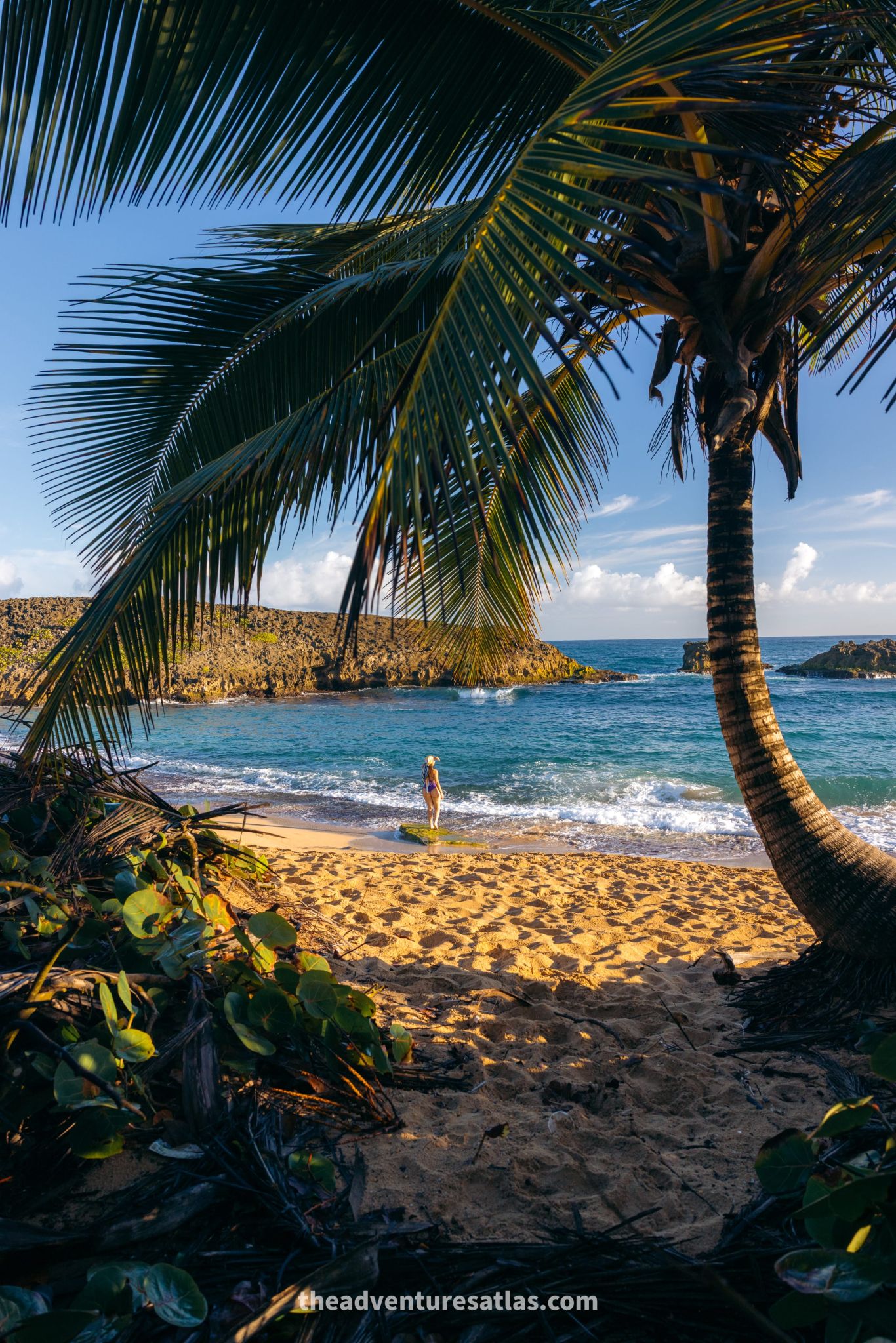 Woman standing on the beach in Manati, Puerto Rico