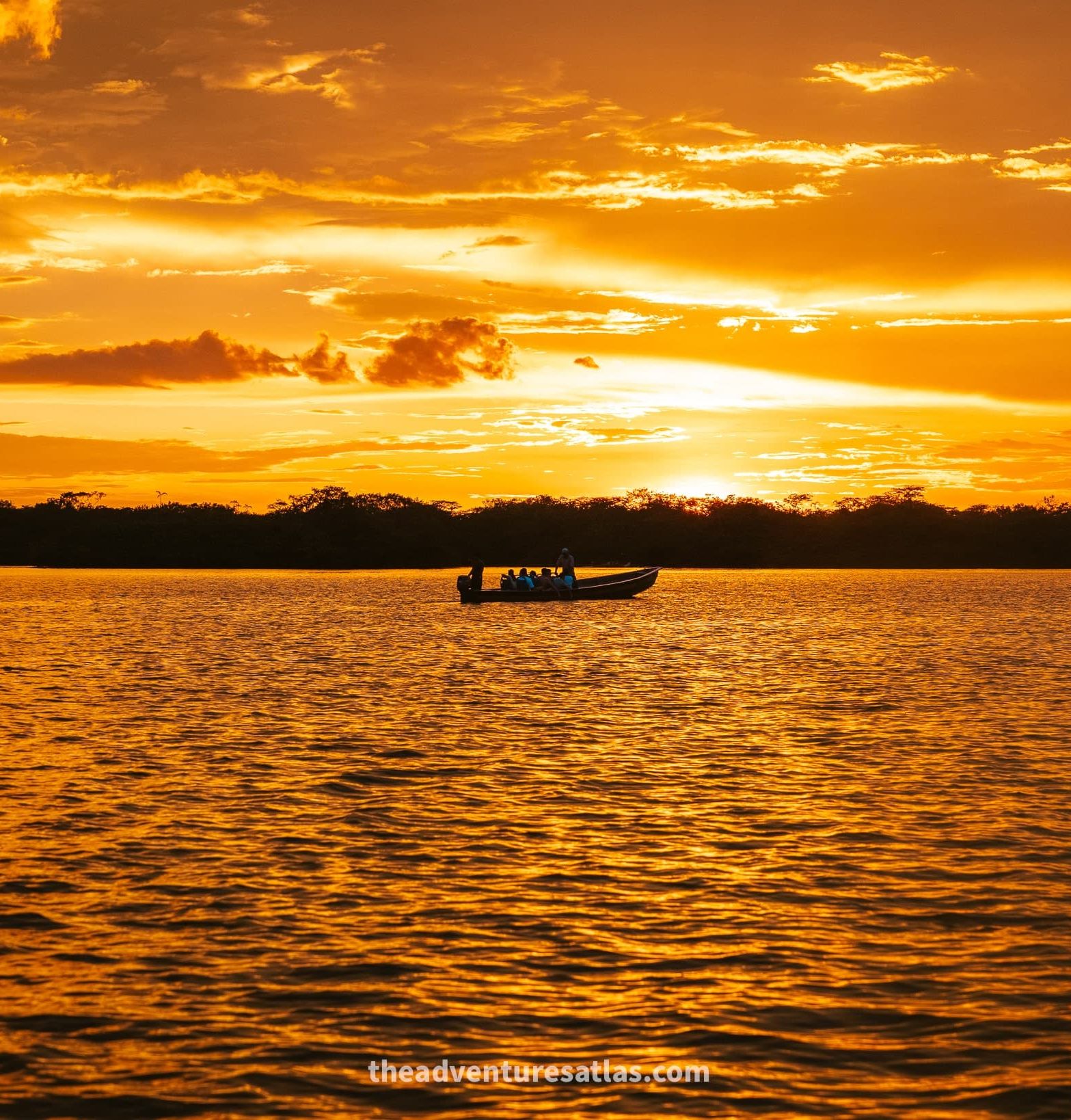 A boat at sunset in the Amazon