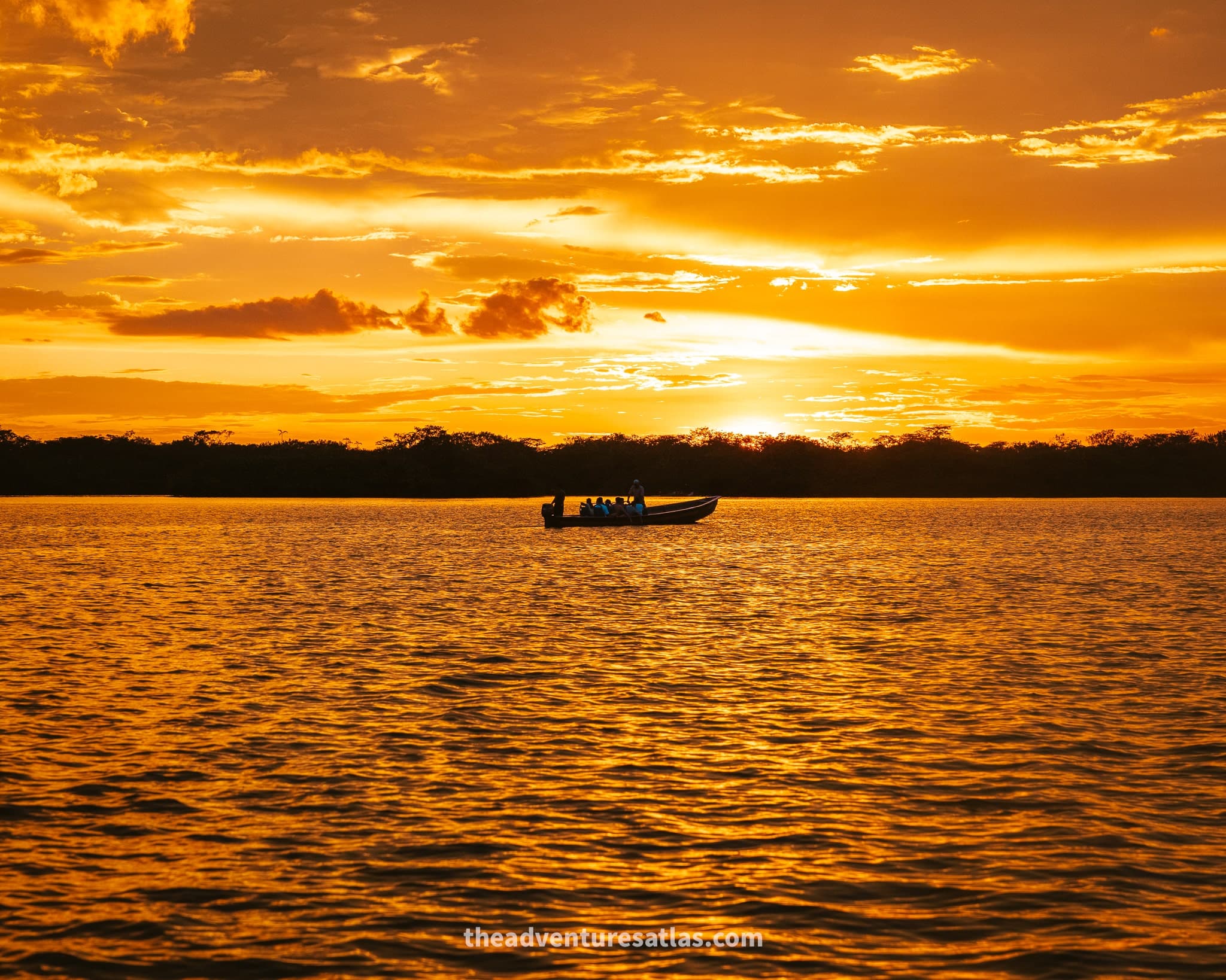 A boat in a lagoon at sunset in Cuyabeno Nature Reserve in the Amazon in Ecuador