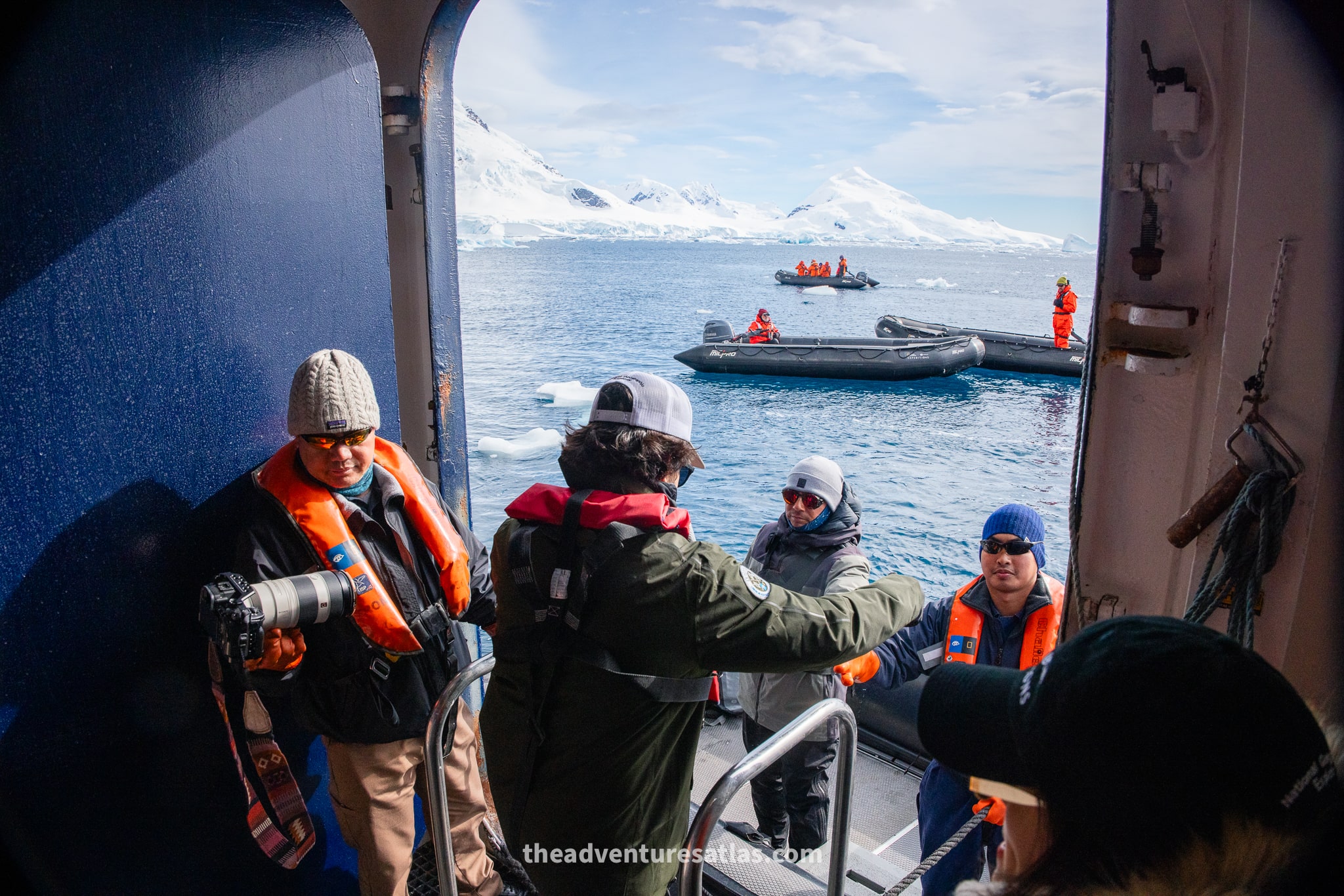 Passengers boarding a zodiac from the National Geographic-Lindblad Expedition ship