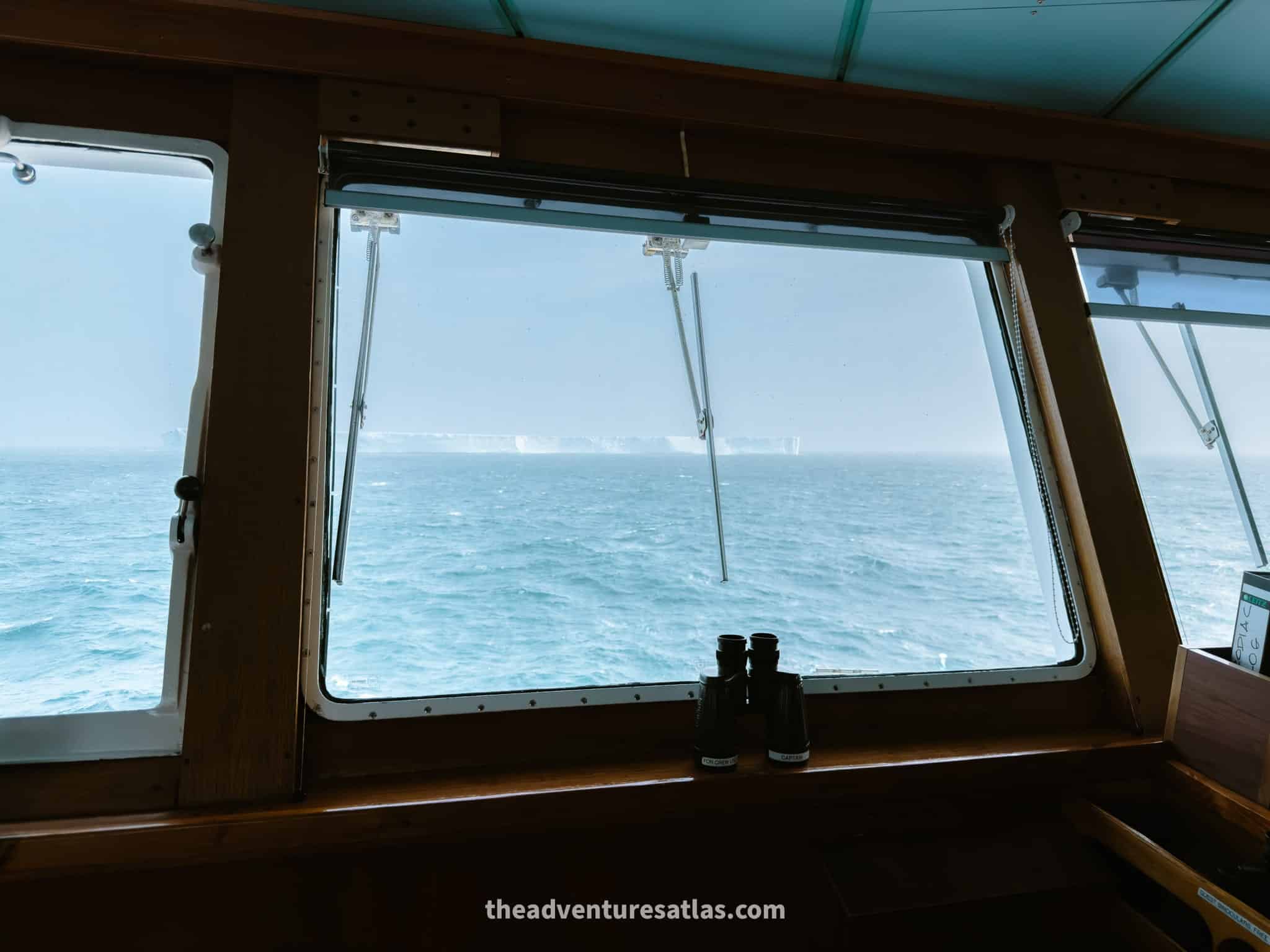 A view of a giant glacier out the window of the bridge on the National Geographic Explorer in the Southern Ocean